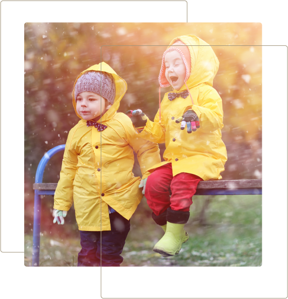Two kids wearing raincoats - Terrey Hills Early Learning Centre